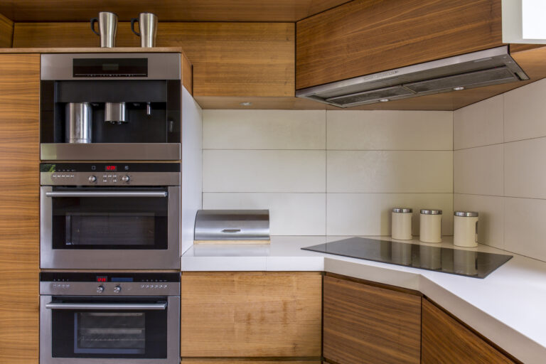 Close-up of modern kitchenette with wooden furniture