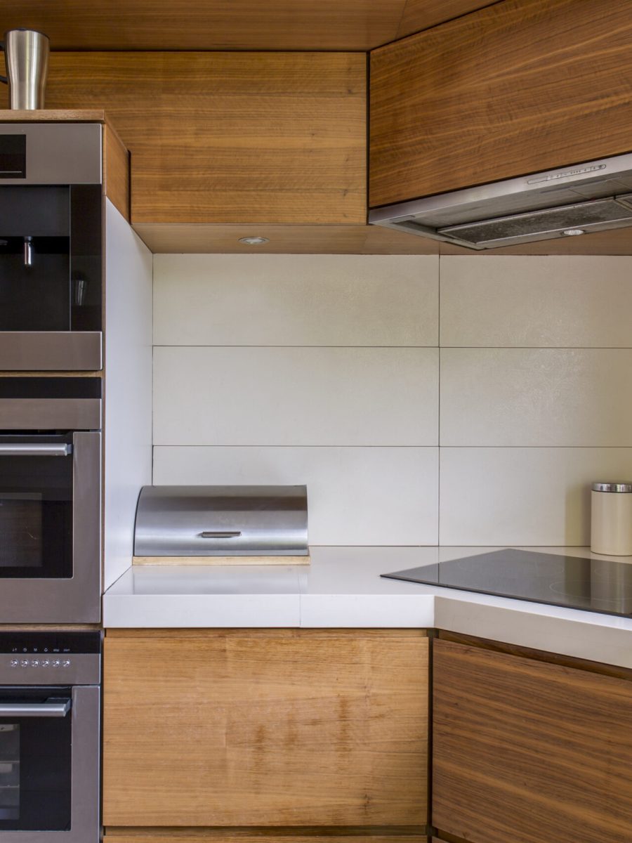 Close-up of modern kitchenette with wooden furniture